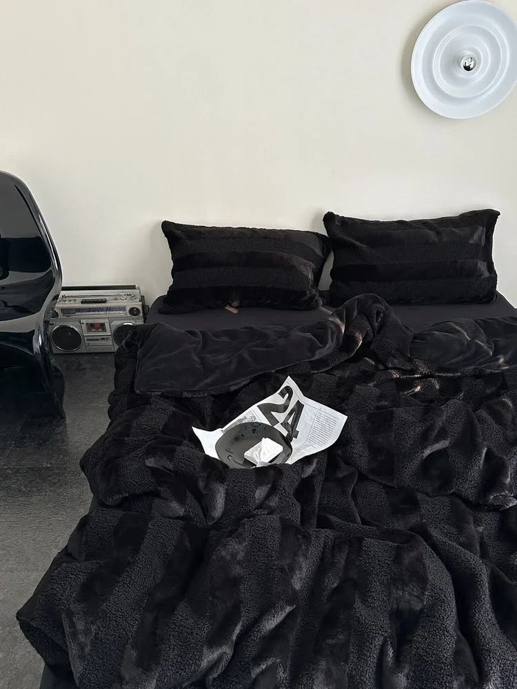 Black plush bedding set styled with retro boombox and industrial chair - RoomDen