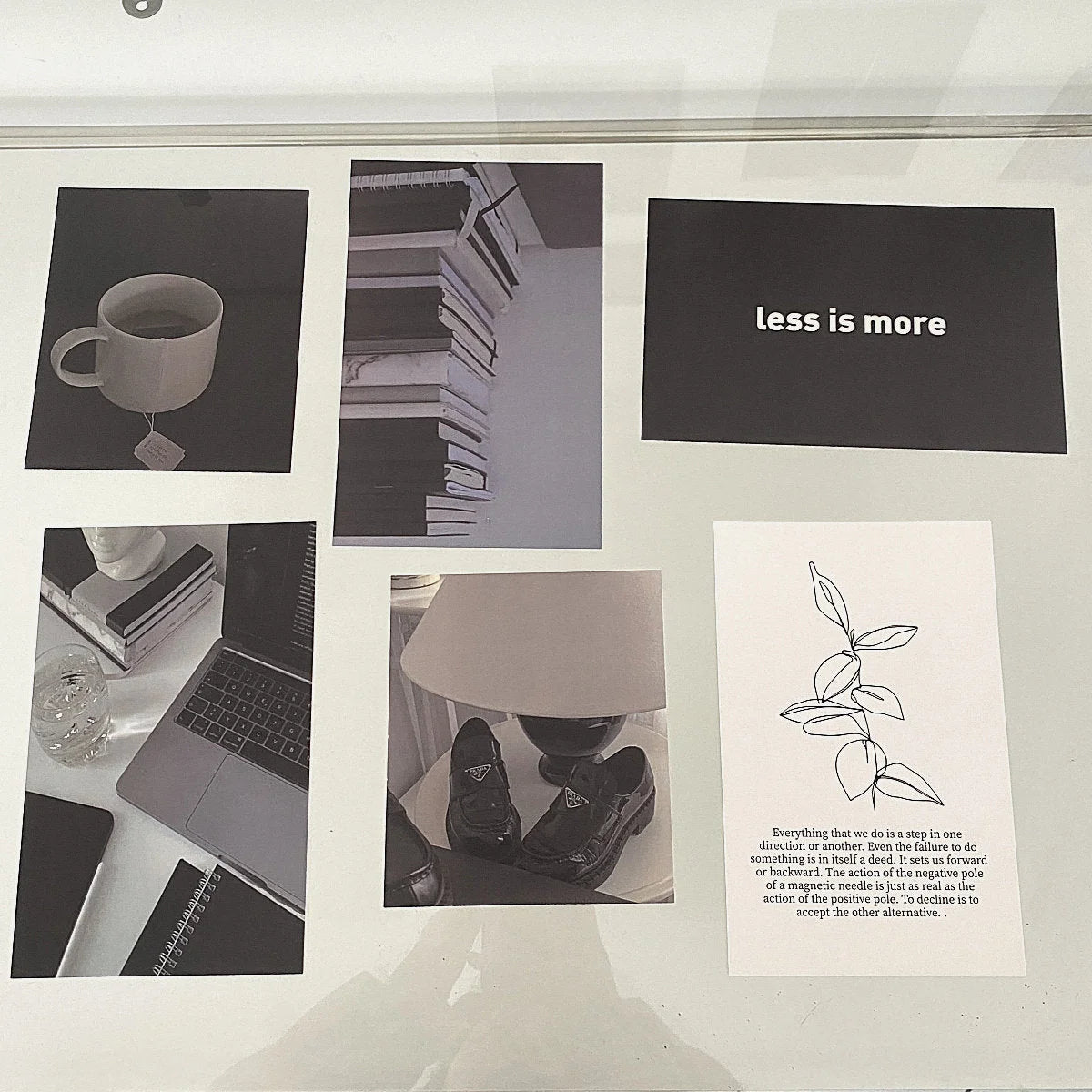 Minimalist monochrome wall collage kit displayed in a clear frame, featuring quotes and aesthetic photos. - RoomDen