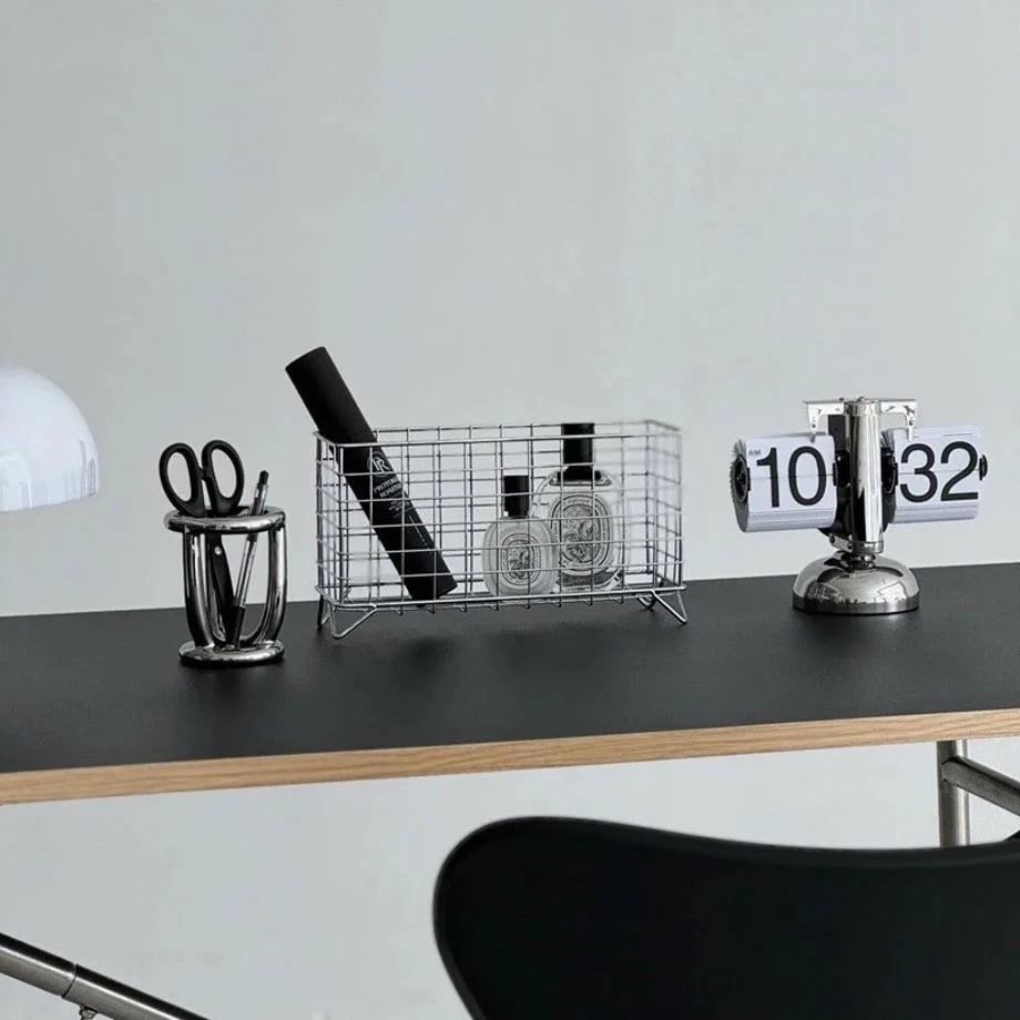 Lifestyle view of the Wireframe Grid Metal Desktop Organizer on a modern desk with a flip clock. - RoomDen