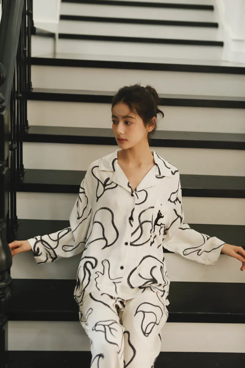 Relaxed Fit Cotton Sateen Loungewear Sitting on Stairs