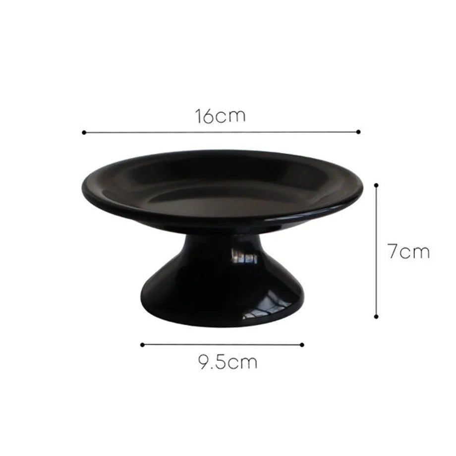 A black pedestal jewelry dish with dimension callouts: 16cm diameter, 7cm height, 9.5cm base. - RoomDen