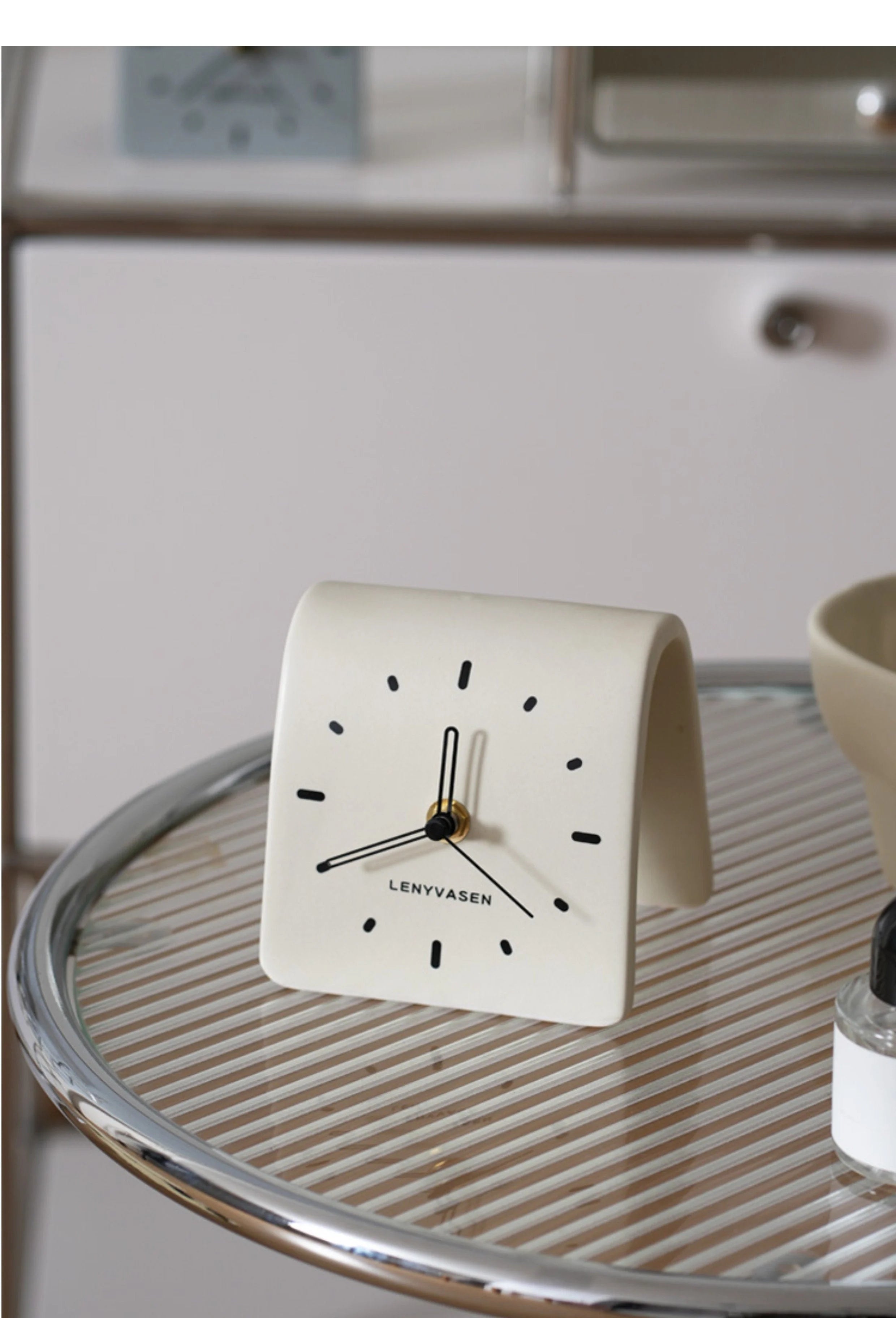 Creamy White Matte Arch Ceramic Table Clock on a modern glass and chrome side table - RoomDen