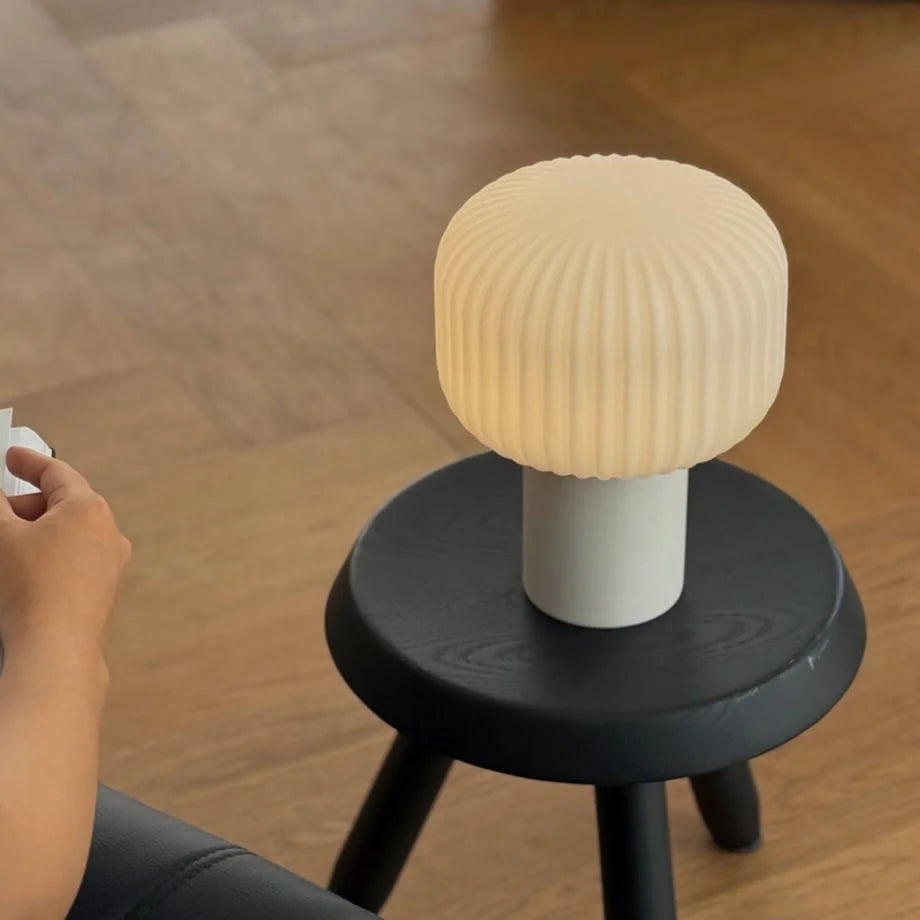 Close-up of the warm light from the Pleated Glass Mushroom Accent Lamp during the day - RoomDen