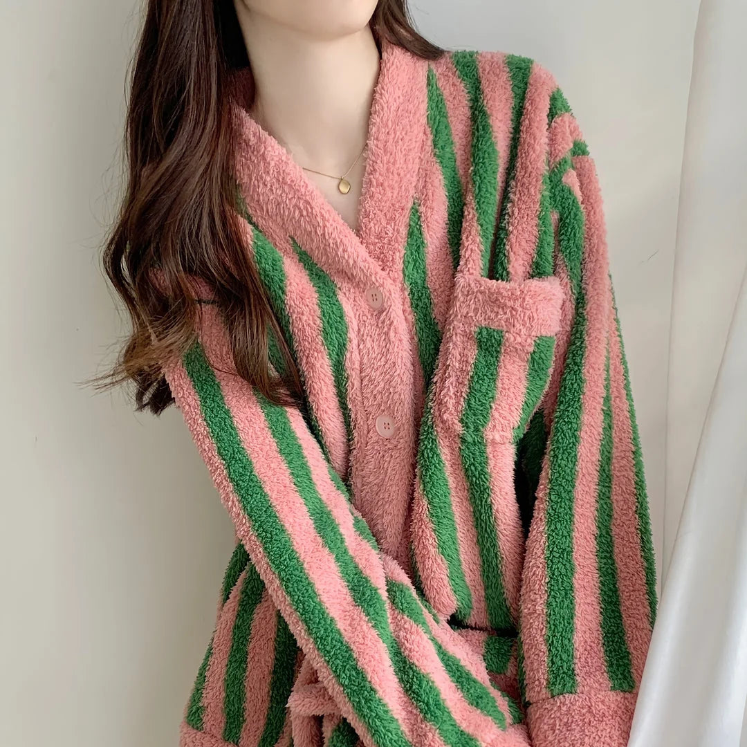 Detailed shot of the soft texture and chest pocket on the Pink & Green Striped Fleece Pajama Set - RoomDen