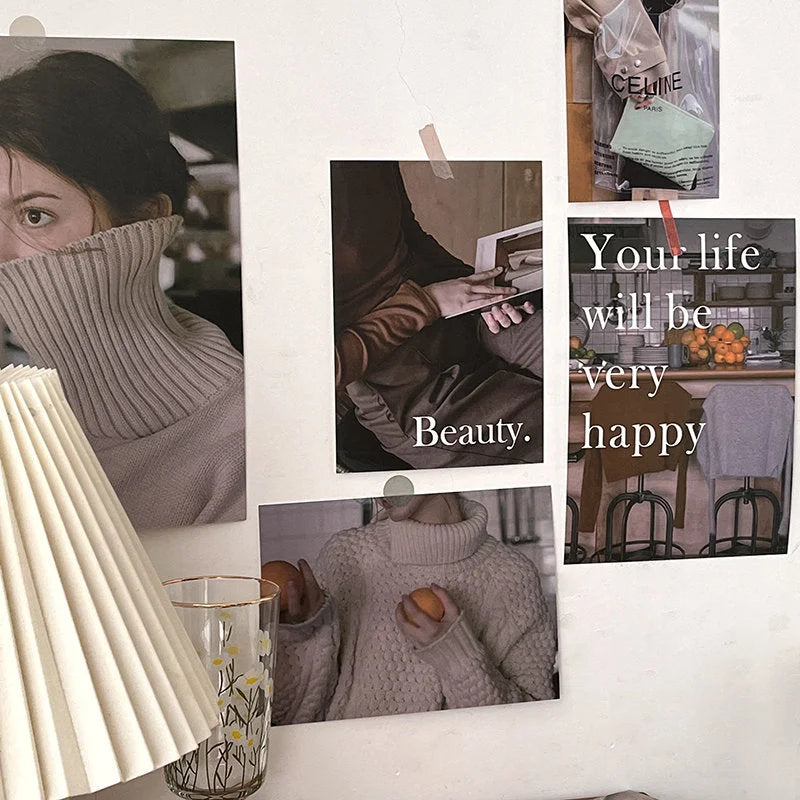 A close-up of a wall decorated with a vintage film aesthetic collage kit, with a pleated lamp in the foreground. - RoomDen