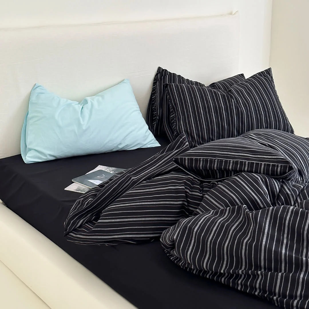 Black Striped Bedding Set Styling with Magazine on Bed - RoomDen