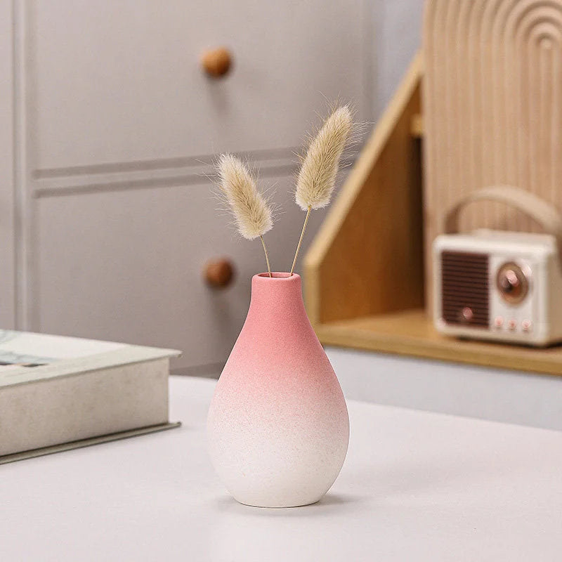 Pink ombre teardrop-shaped ceramic vase with dried bunny tail grass inside - RoomDen.