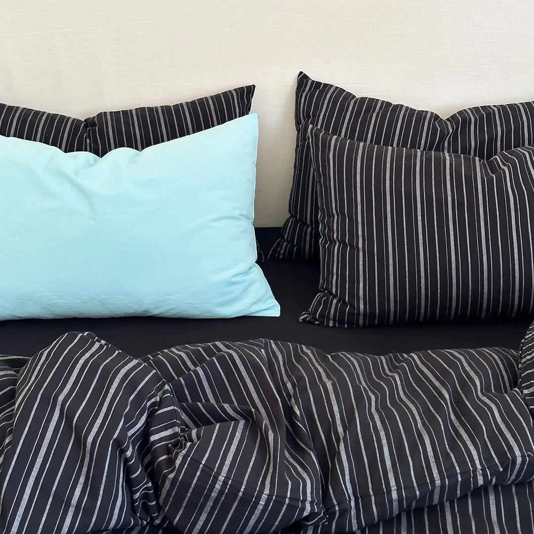 Close up of Black Pinstripe Duvet Cover and Light Blue Pillow Texture - RoomDen