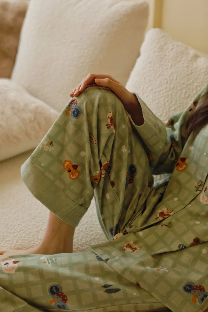 Close-up detail of pajama pants fabric texture and cute mushroom koala print