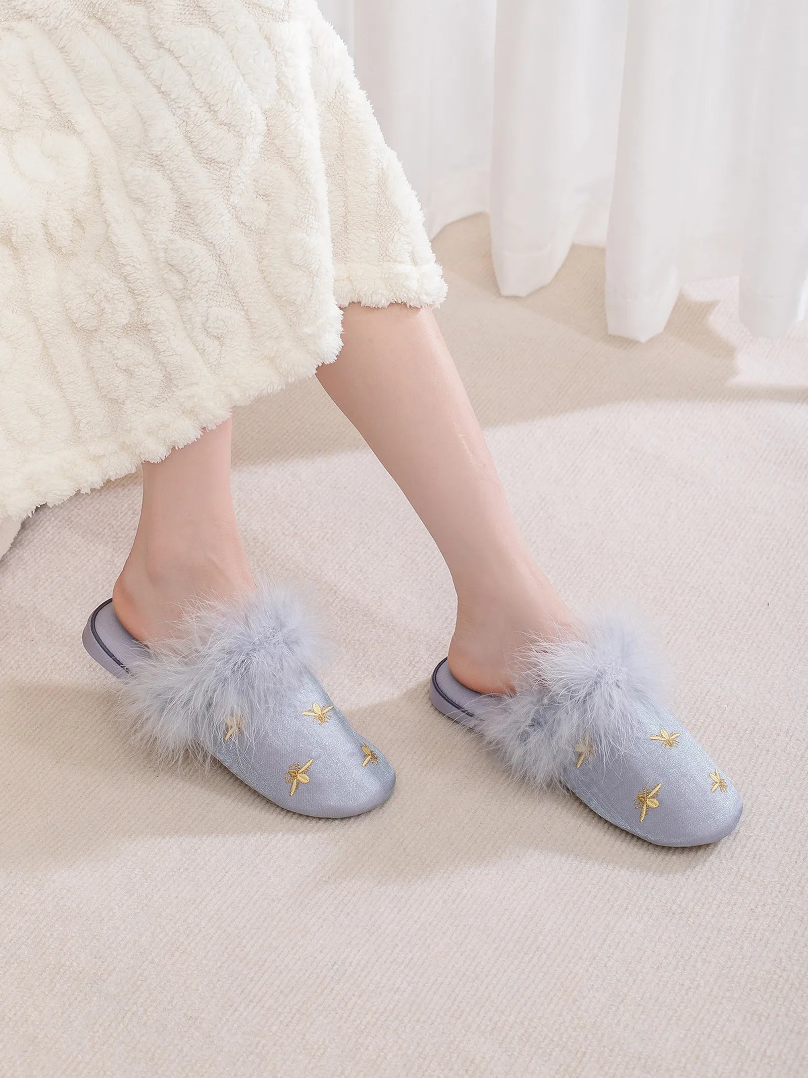 Model wearing Blue satin bee slippers with white knit loungewear - RoomDen