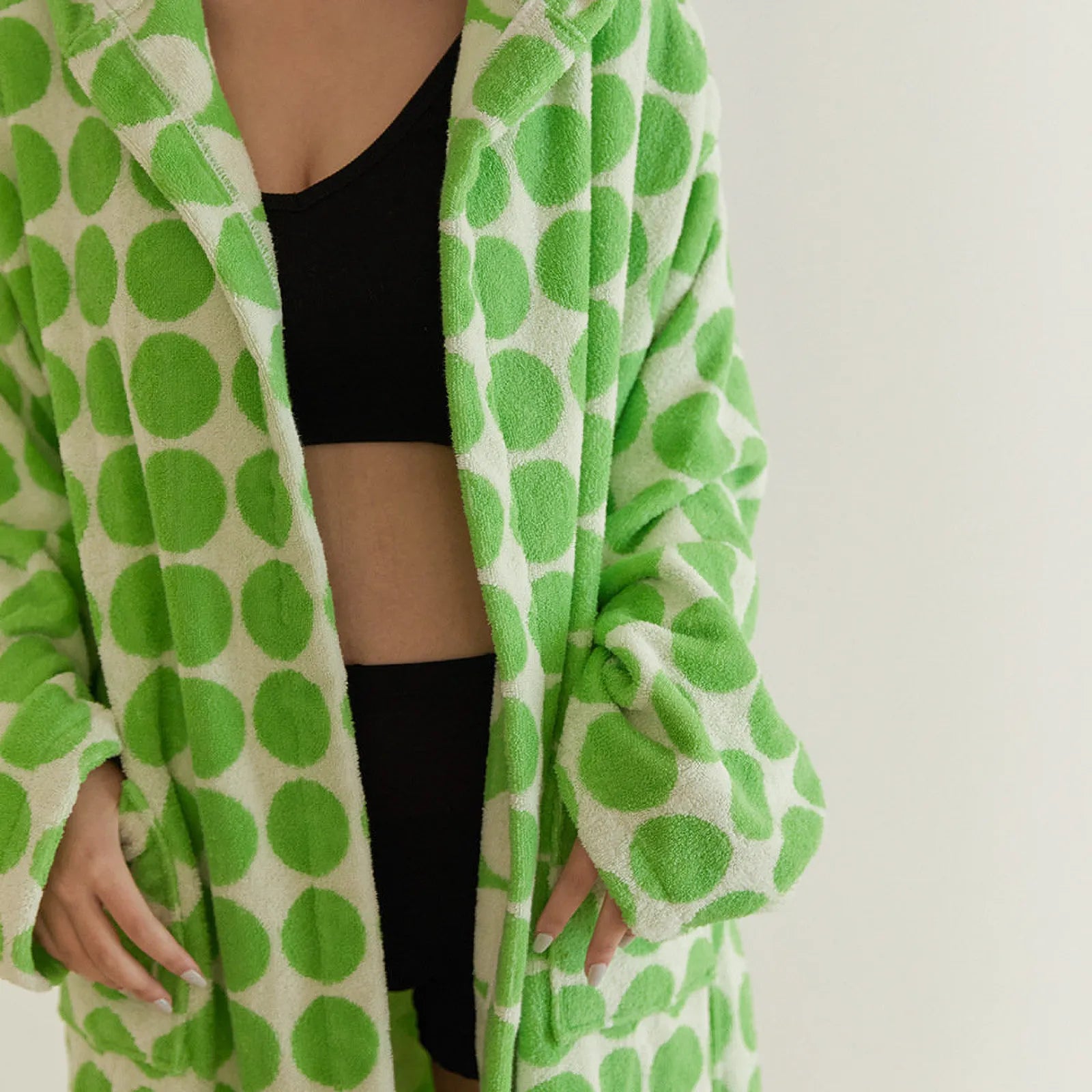 Woman wearing Green Polka Dot Cotton Robe showing open front design and black inner wear - RoomDen