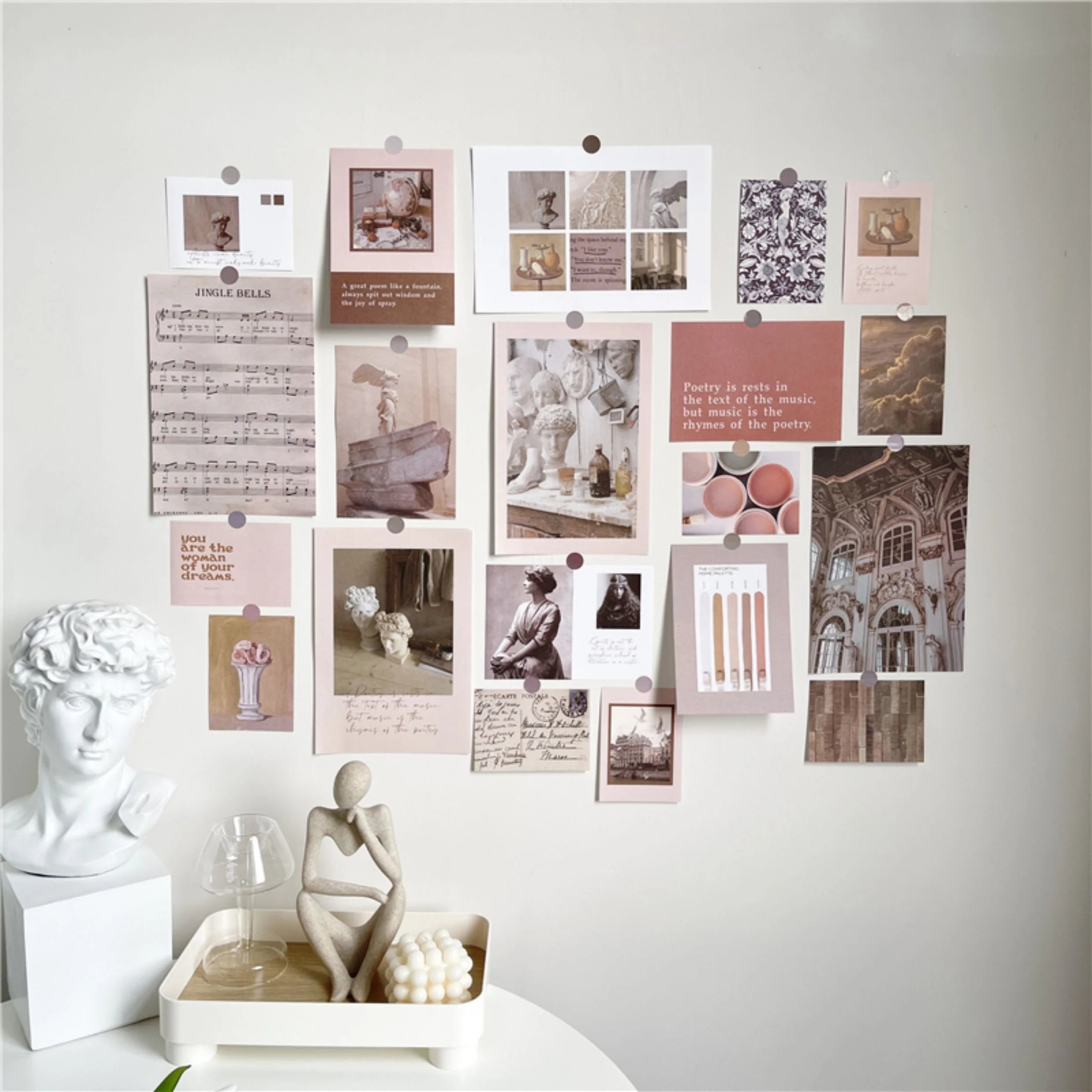 Vintage Academia wall collage kit arranged on a white wall above a desk with a classical bust statue - RoomDen.