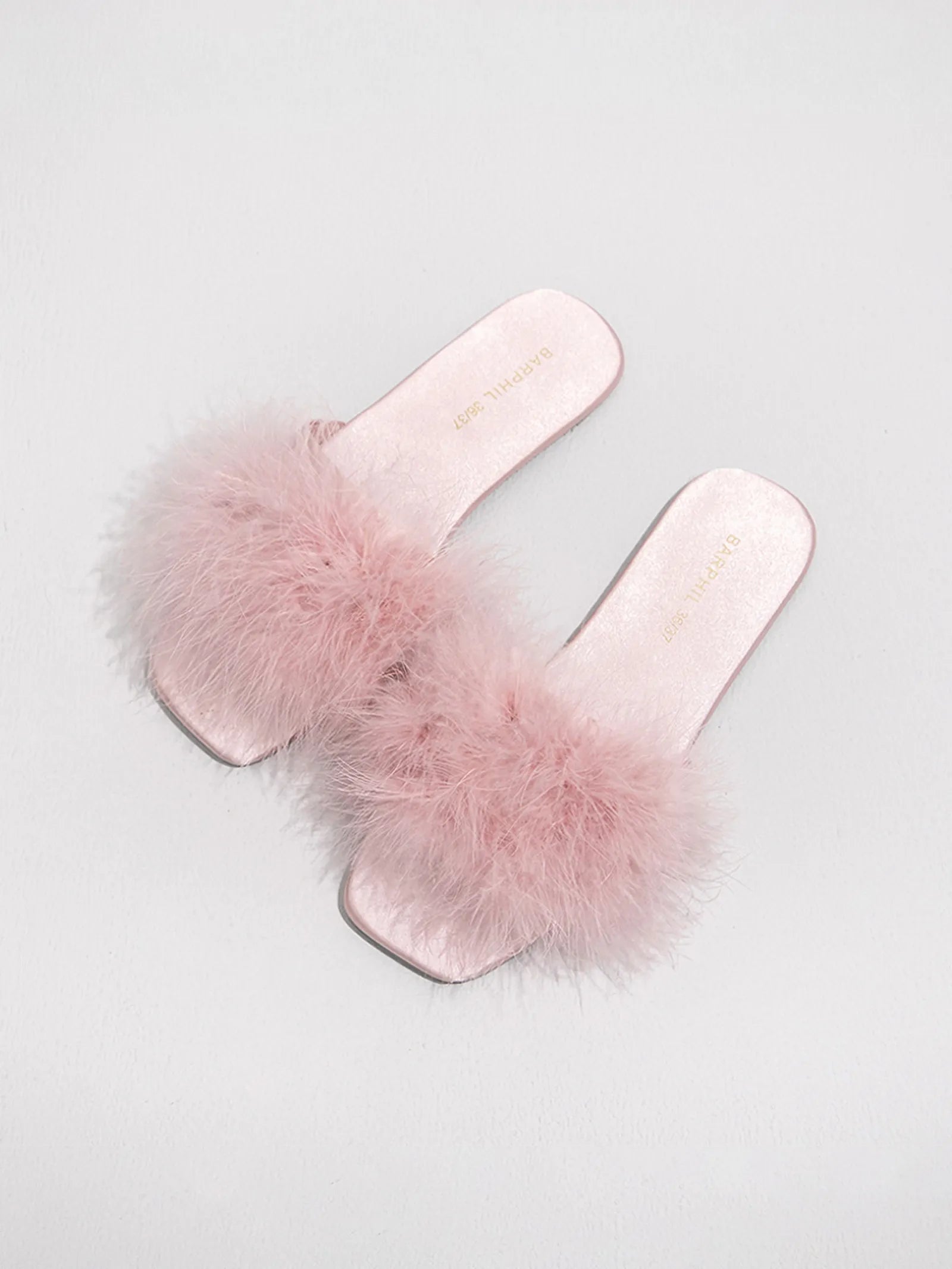 Top down view of lavender faux fur slippers flatlay - RoomDen