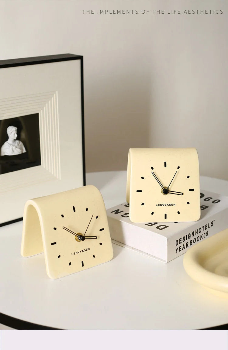 Duplicate image of two Butter Yellow Matte Arch Ceramic Table Clocks on a white desk - RoomDen