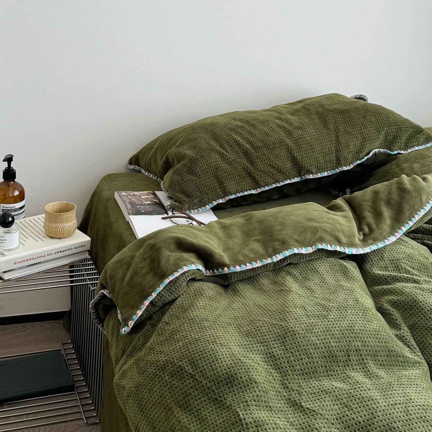 Angled view of the Olive Green Waffle Fleece Duvet Cover, showing its soft texture and drape.