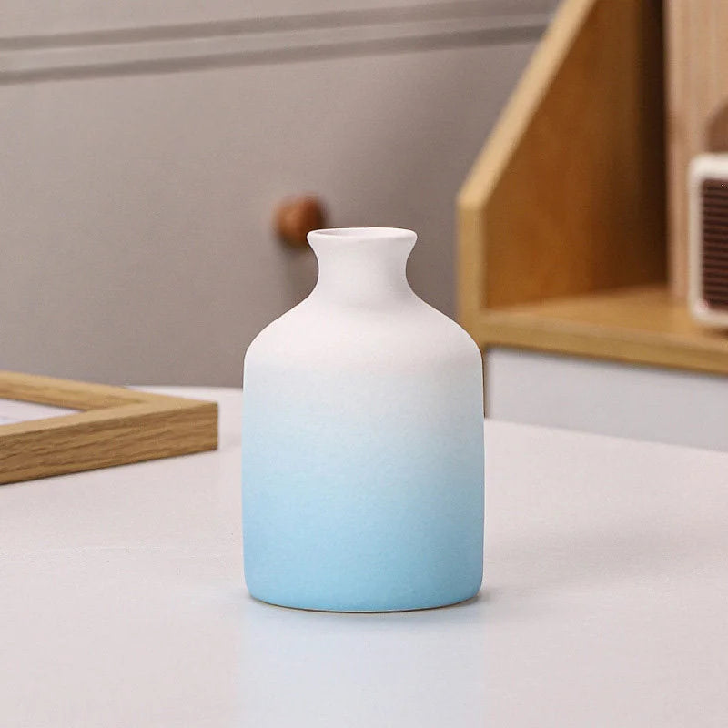 Blue Ombre bottle-shaped frosted ceramic vase on a white surface - RoomDen.