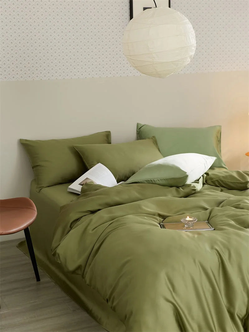 Olive green Cooling Tencel bedding set on a bed with a paper lantern hanging above, styled in a Japandi bedroom - RoomDen.
