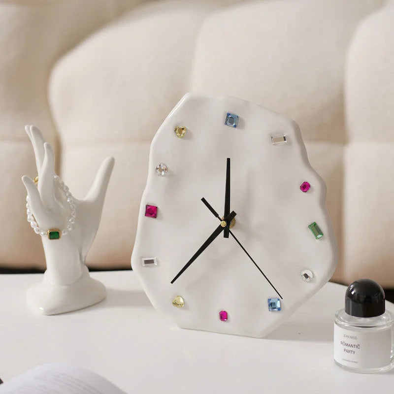 White Wavy Jeweled Ceramic Clock on a bedside table next to a ceramic hand jewelry holder - RoomDen