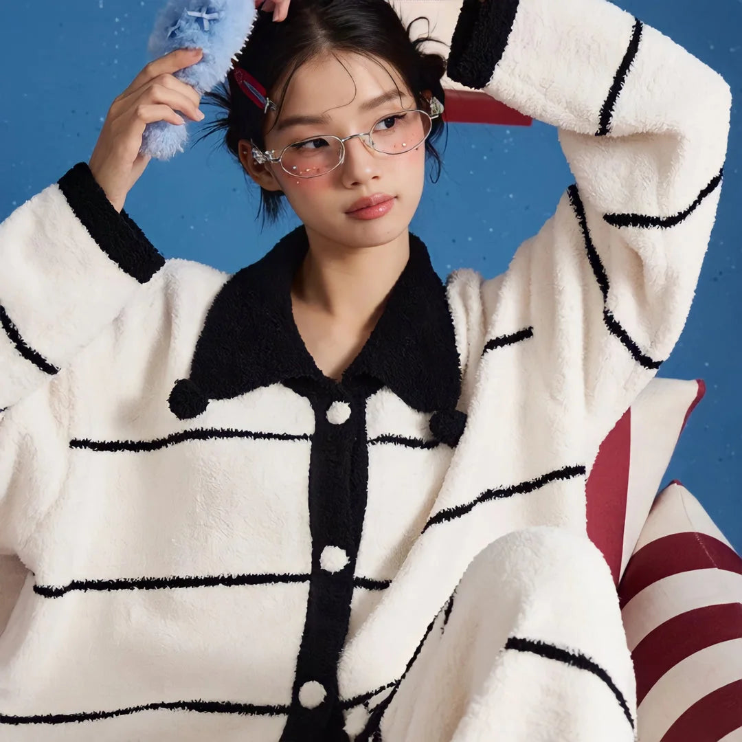 Close-up of the model's face and the pajama top, highlighting the soft collar and fuzzy texture - RoomDen.