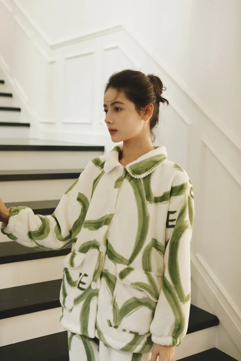 Side profile of a model in the Plush Graffiti Love Fleece Pajama Set, showing the collar detail - RoomDen.