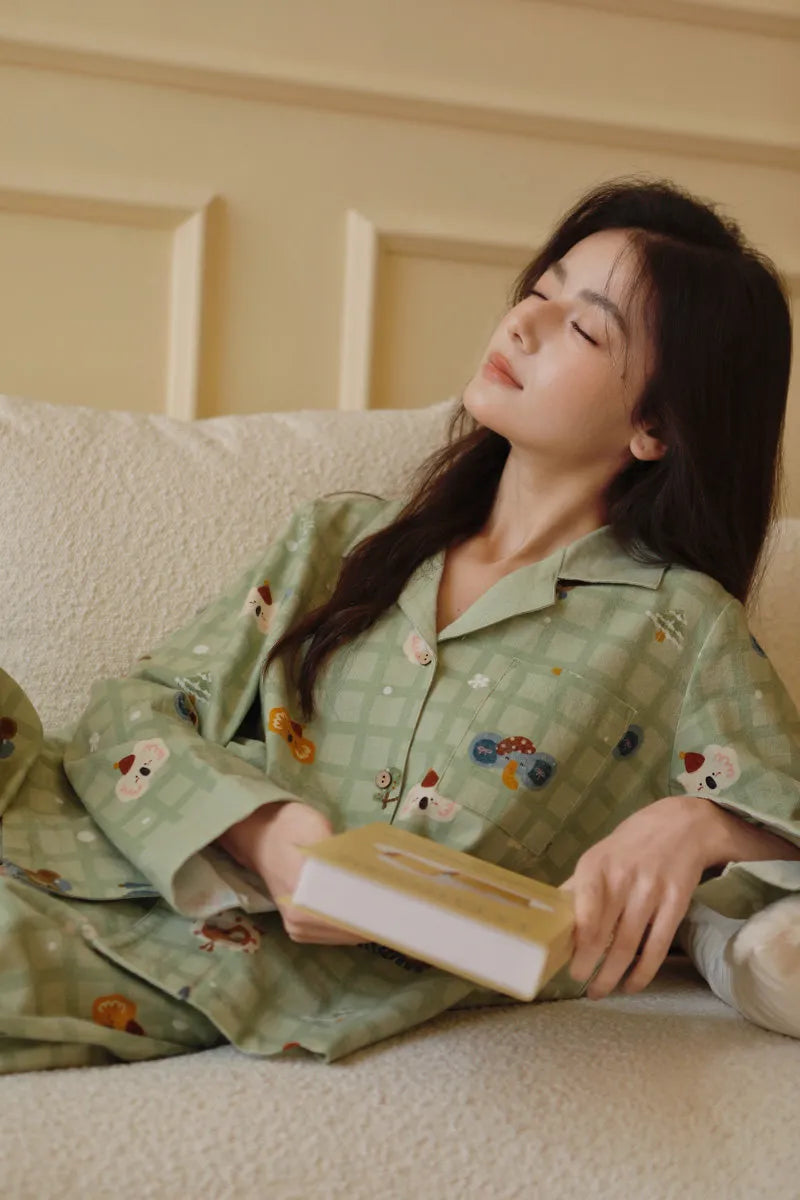 Woman resting head back on sofa wearing soft koala plaid pajama set - RoomDen