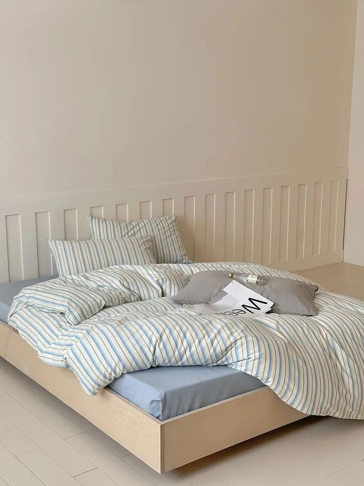 Full view of the Blue Striped Washed Cotton Bedding Set in a minimalist bedroom setting. - RoomDen