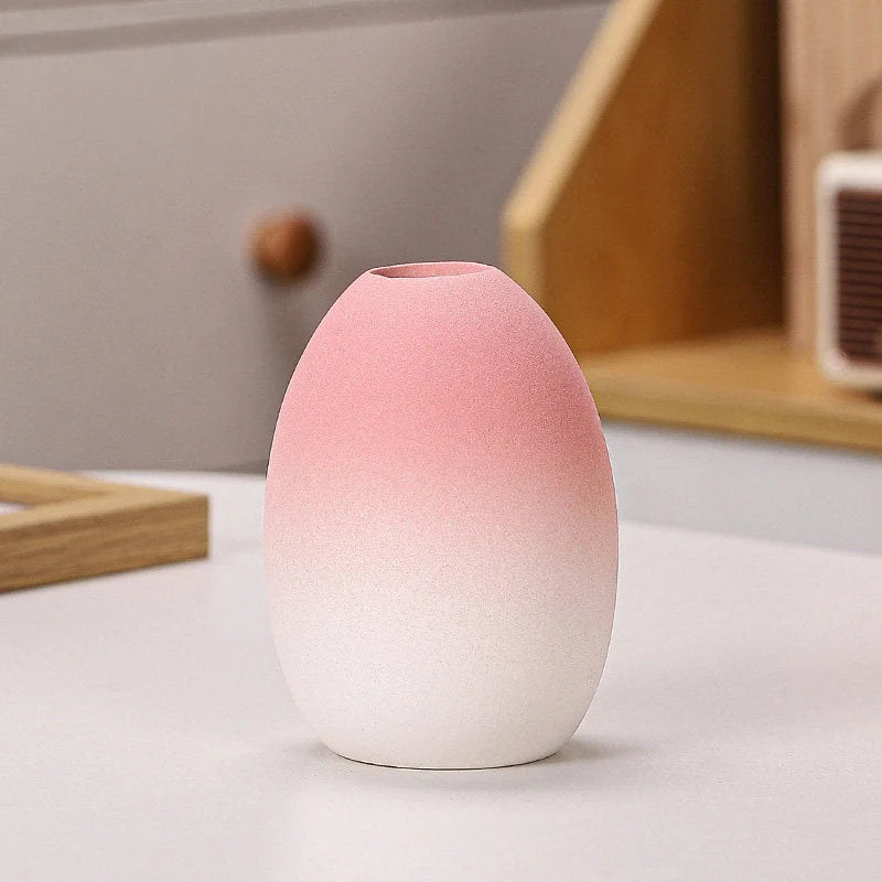 Pink Ombre egg-shaped frosted ceramic vase on a white surface - RoomDen.