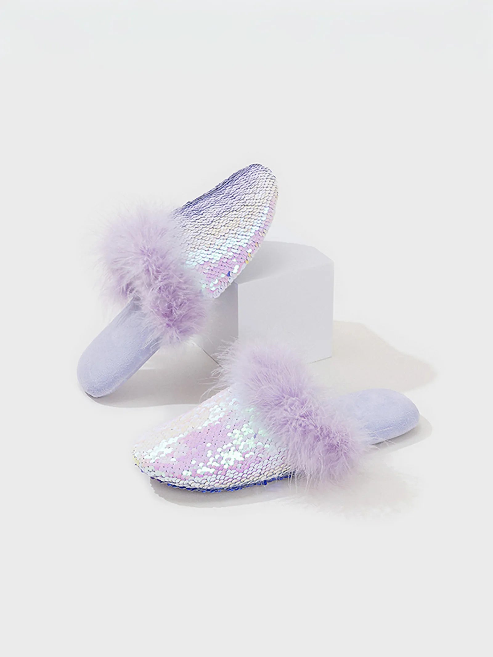 Angled view of lavender sparkly mule slippers on white background - RoomDen