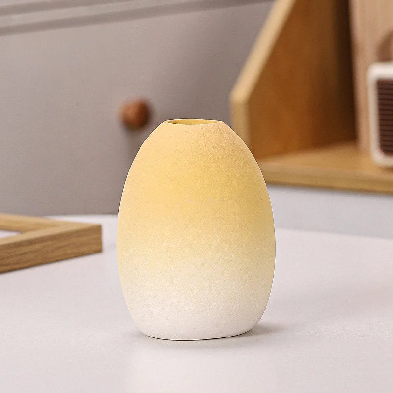 Yellow Ombre egg-shaped frosted ceramic vase on a white surface - RoomDen.