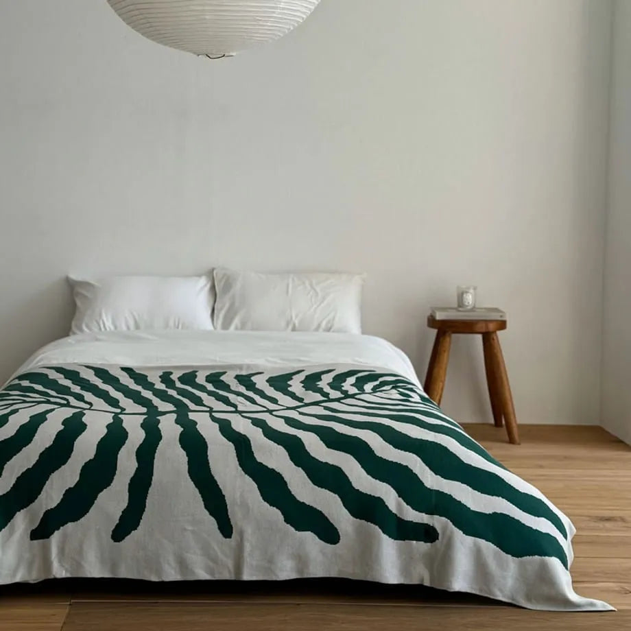 Leaf pattern flannel fleece throw blanket in a modern cozy home setting – RoomDen