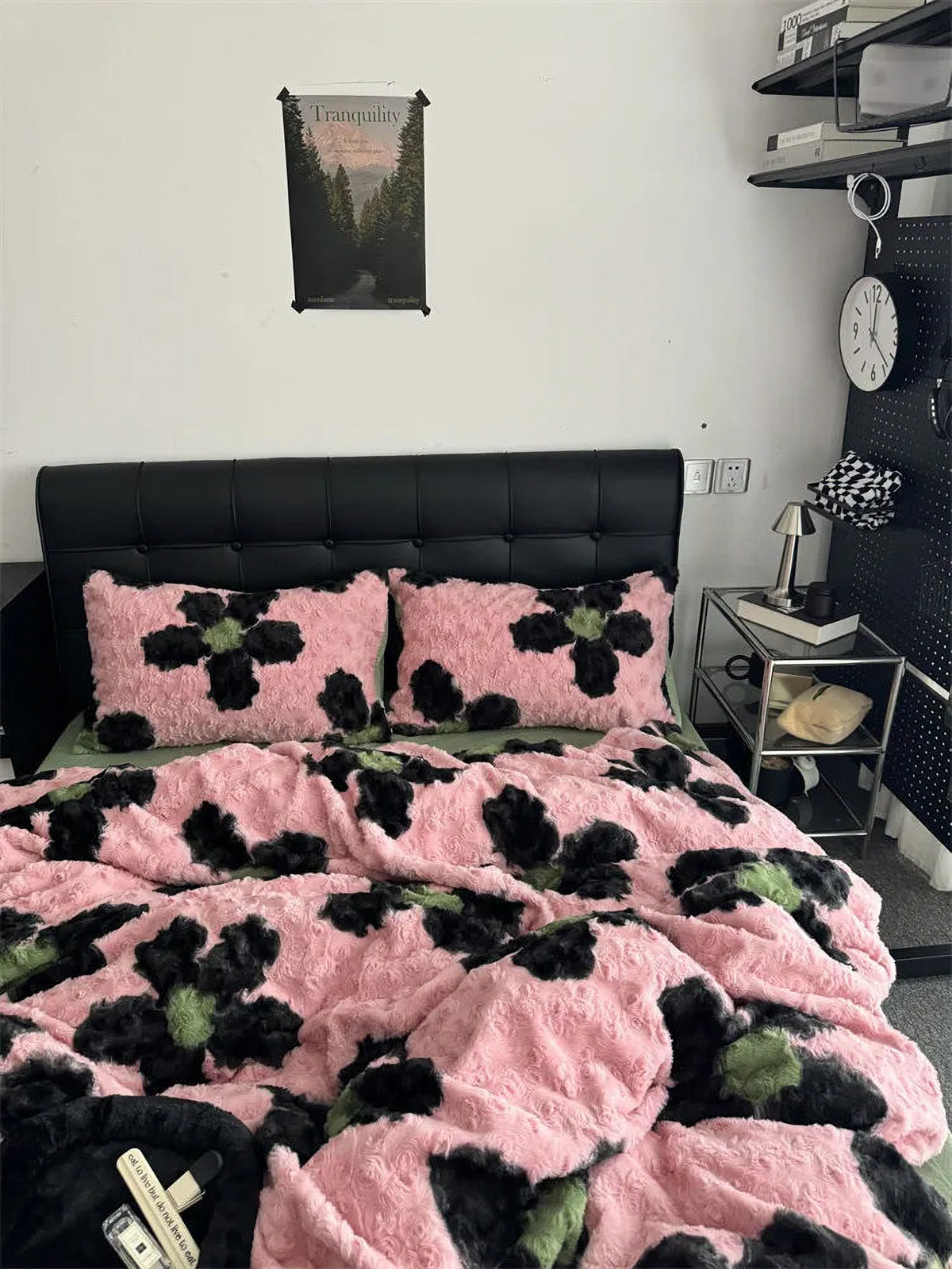 Detail shot of pink and black flower plush duvet cover texture in a Y2K style room.