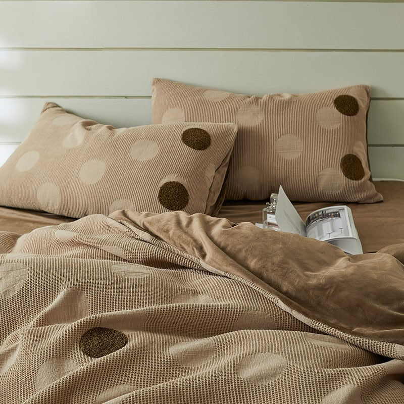 Close-up of polka dot waffle cotton duvet cover and pillows in brown tones – RoomDen