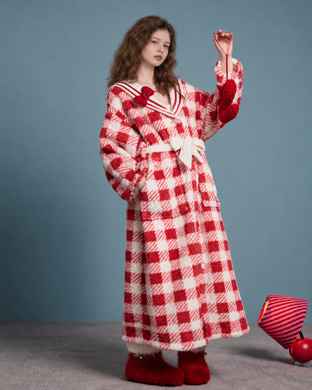 Red-and-White Plaid Fleece Robe – front view with raised arm and tie belt - Roomden