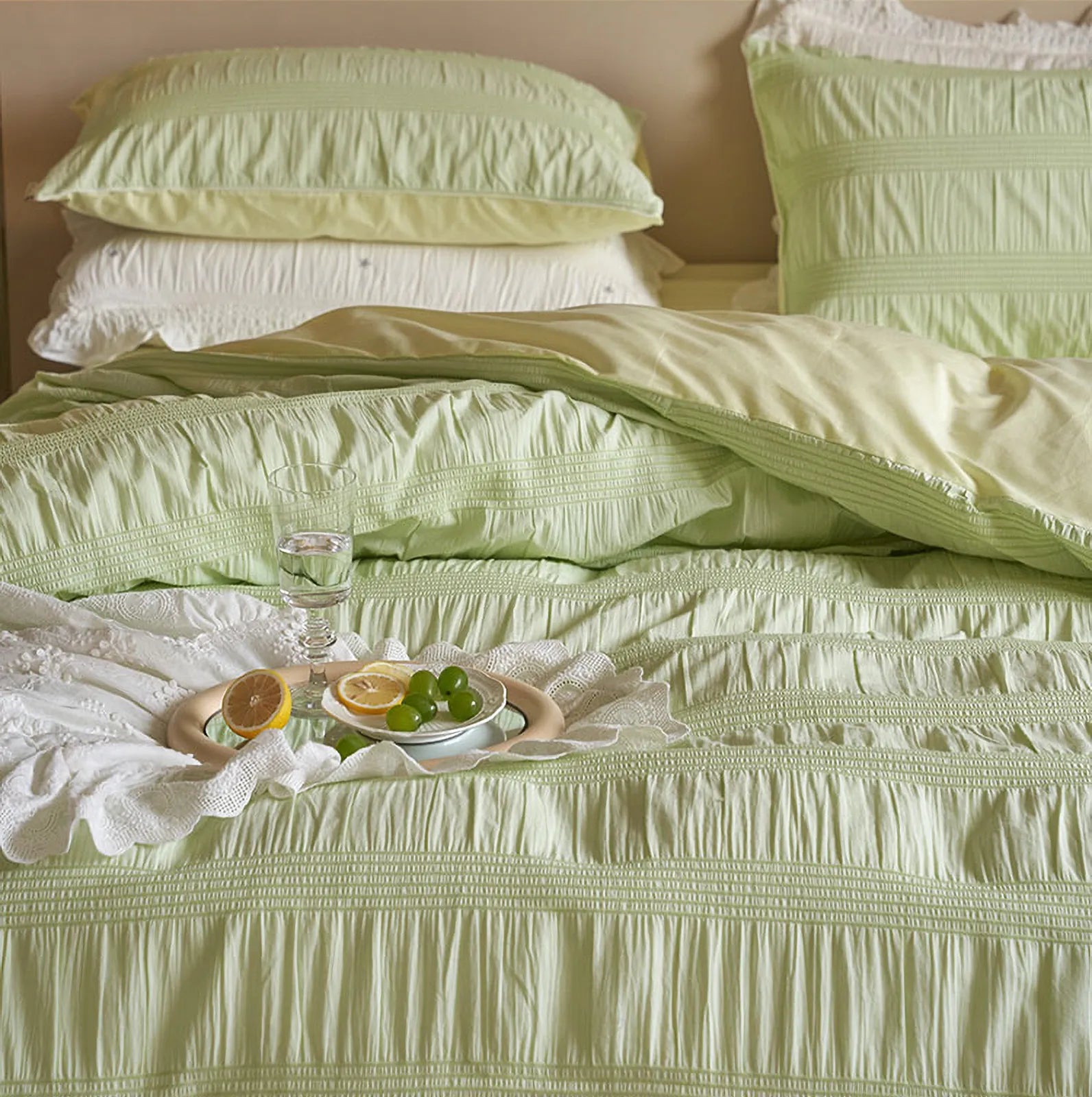 Mint green washed cotton bedding front view with breakfast tray | RoomDen