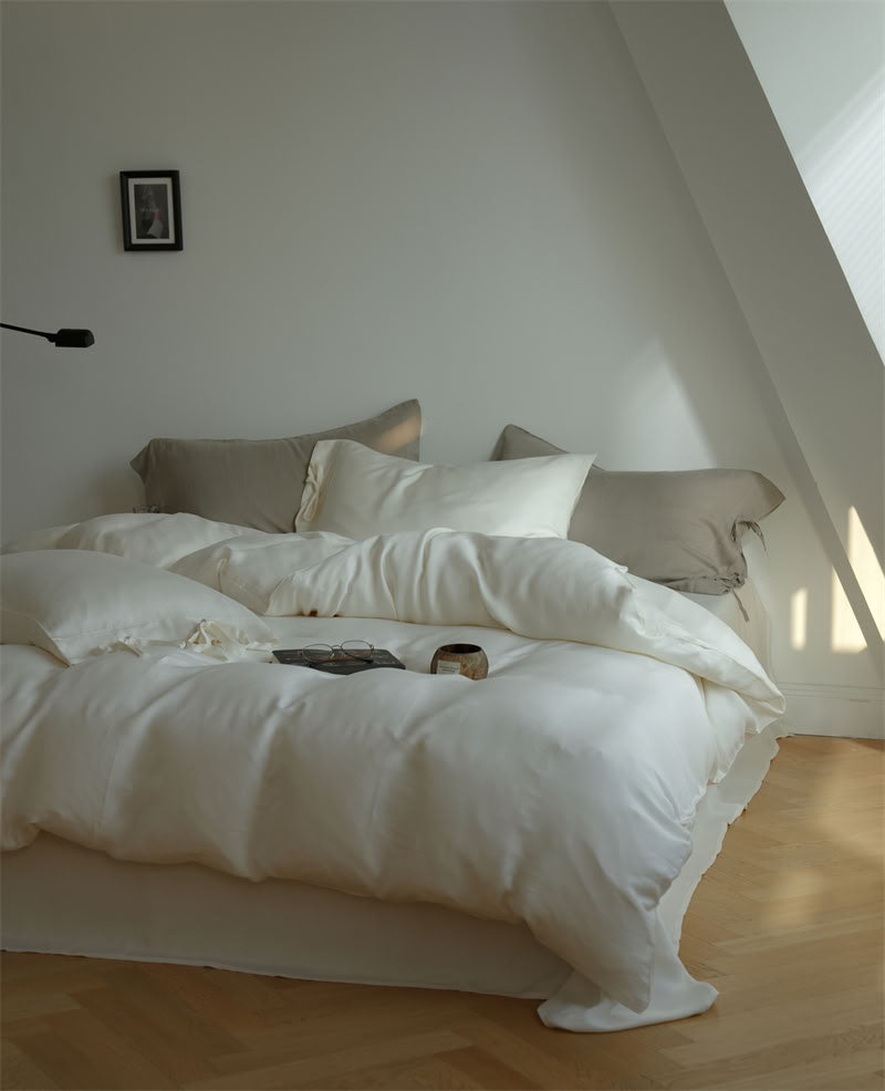 Cream white Cooling Tencel bedding set on wooden floor in minimalist bedroom – RoomDen
