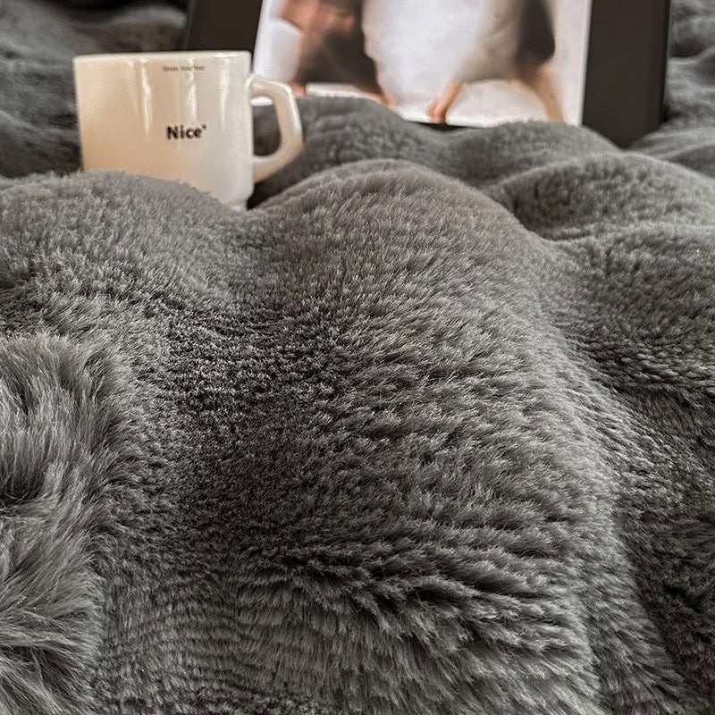Close-up of gray faux fur texture showing soft fluffy surface – RoomDen