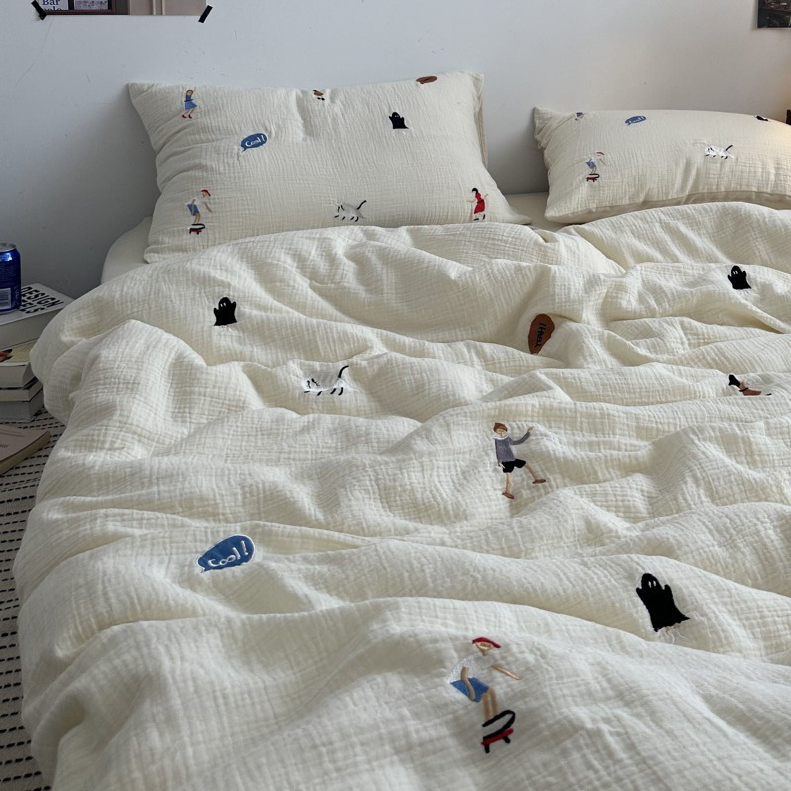 RoomDen White washed cotton bedding set featuring whimsical embroidery of skater boy and dancing girl.