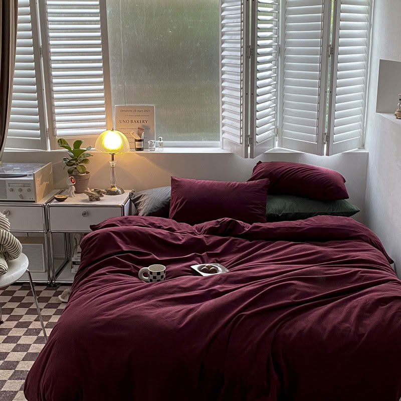 Solid Wine Red velvet bedding set with soft plush texture and minimalist cozy bedroom scene - RoomDen