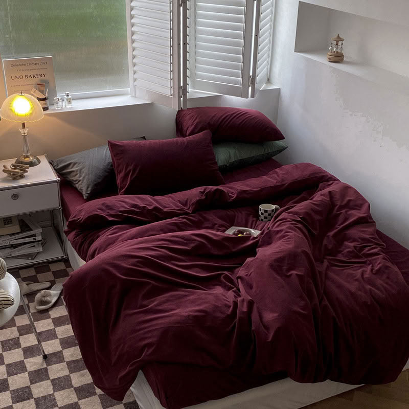 Solid Wine Red velvet bedding set with soft plush texture and minimalist cozy bedroom scene - RoomDen