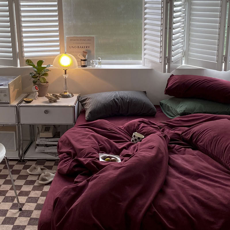 Solid Wine Red velvet bedding set with soft plush texture and minimalist cozy bedroom scene - RoomDen