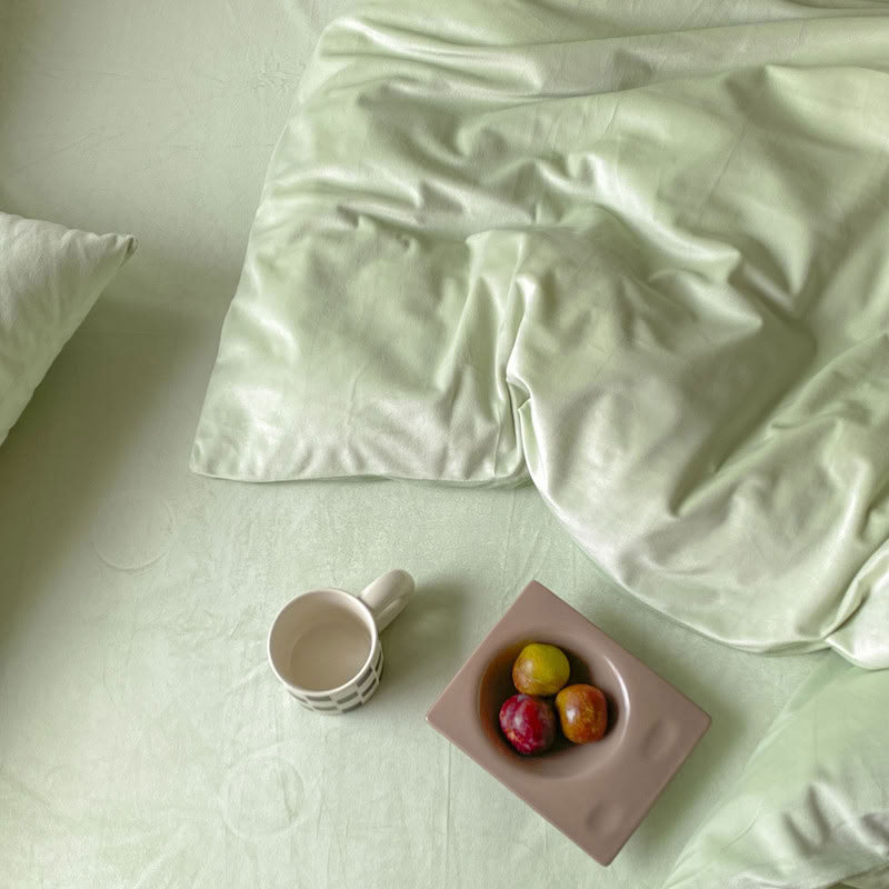 Solid Mint Green velvet bedding set with soft plush texture and minimalist cozy bedroom scene - RoomDen