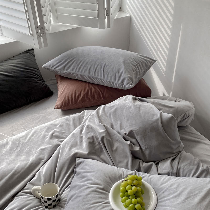 Solid Ivory Grey velvet bedding set with soft plush texture and minimalist cozy bedroom scene - RoomDen