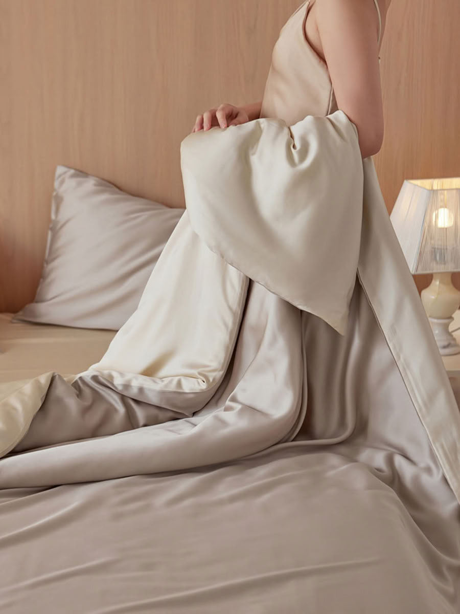 Smooth champagne beige Tencel duvet and pillow showing subtle sheen and elegant drape – RoomDen