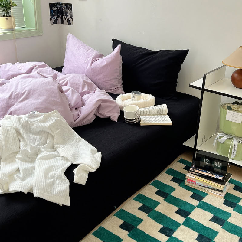 Two-tone purple and black cotton bedding set creating elegant modern contrast – RoomDen