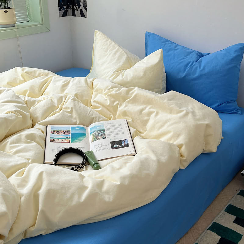 Soft beige and sky blue cotton bedding set styled with book and decor – RoomDen