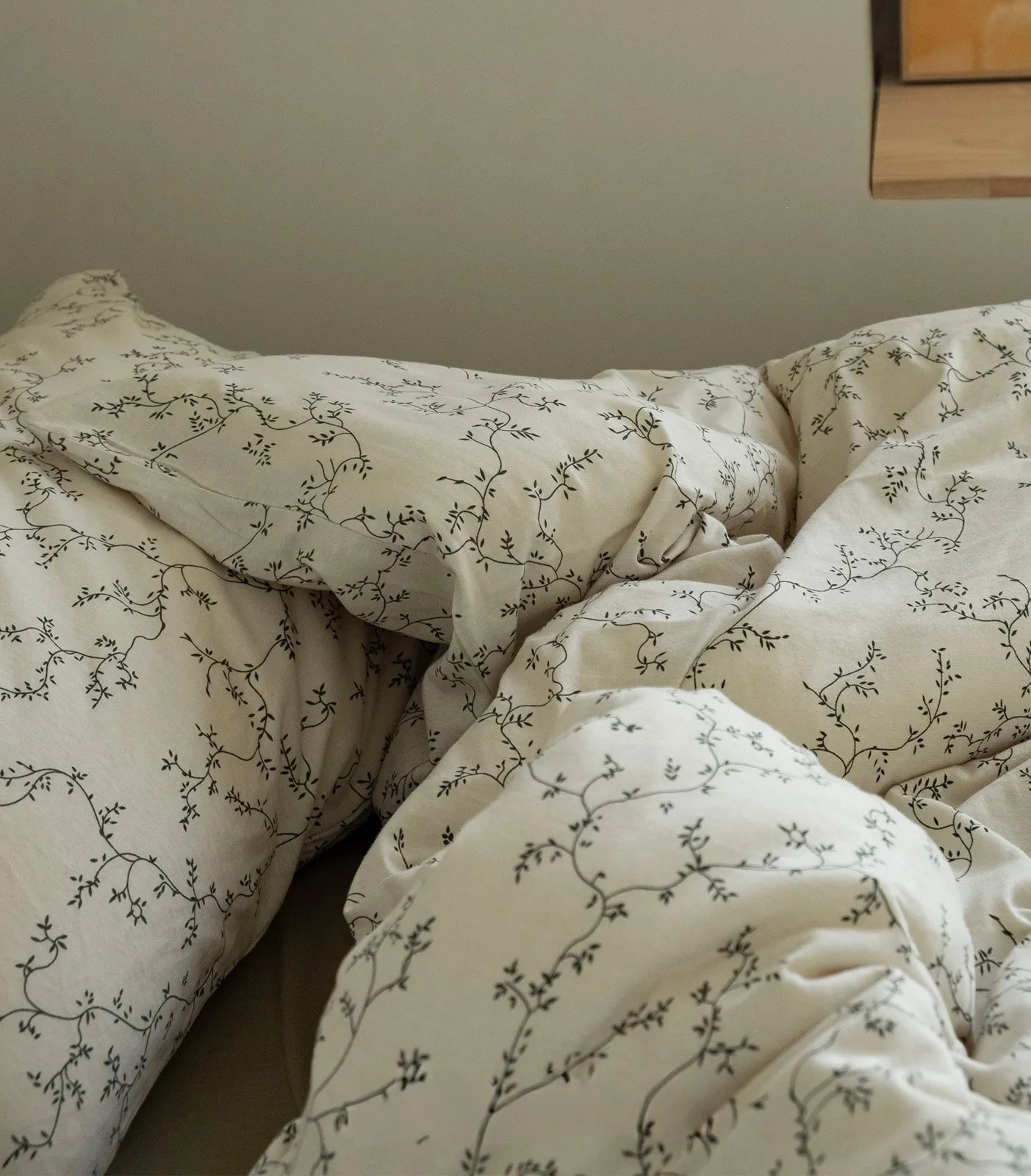 Close up soft washed cotton texture pillowcase details floral vine print RoomDen