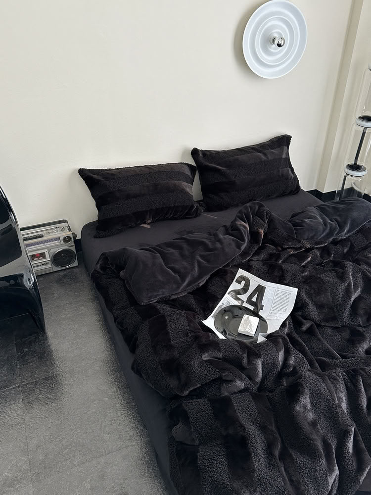 Black plush fleece bedding set with bold wide stripes creating a cozy and stylish modern bedroom look - RoomDen