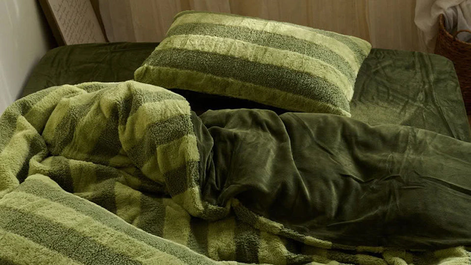 Close-up of ultra-plush Flannel Fleece bedding, emphasizing instant warmth and cozy texture.
