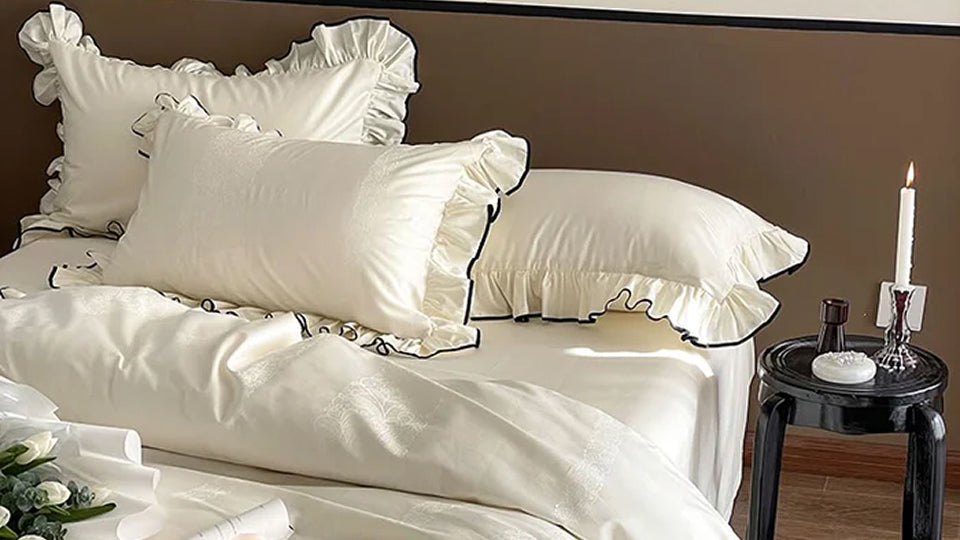 Bedding with elegant ruffle detailing, creating a romantic Shabby Chic aesthetic.
