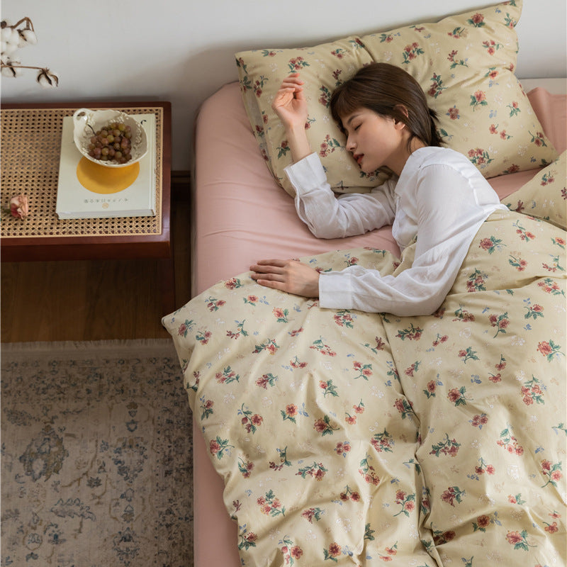 Buttercream Vintage Bouquet Cotton Bedding Set – overhead bedroom scene with a floral duvet and matching pillow - Roomden